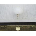 A Danish white standard lamp, mushroom shade with brass top,