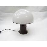 A brown and white Habitat mushroom lamp,