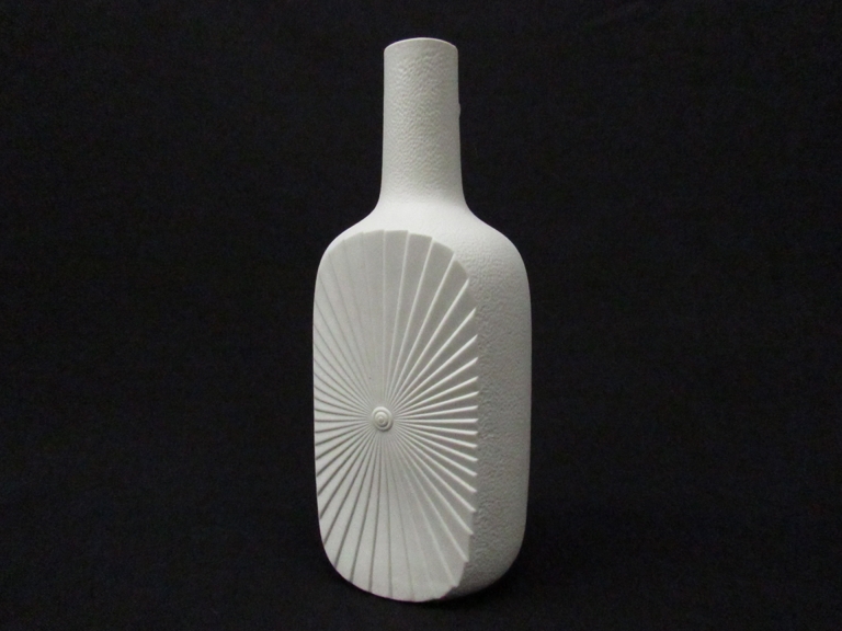 A late 1960's Edelstein large matte white bottle vase with a raised geometric linear Sun power