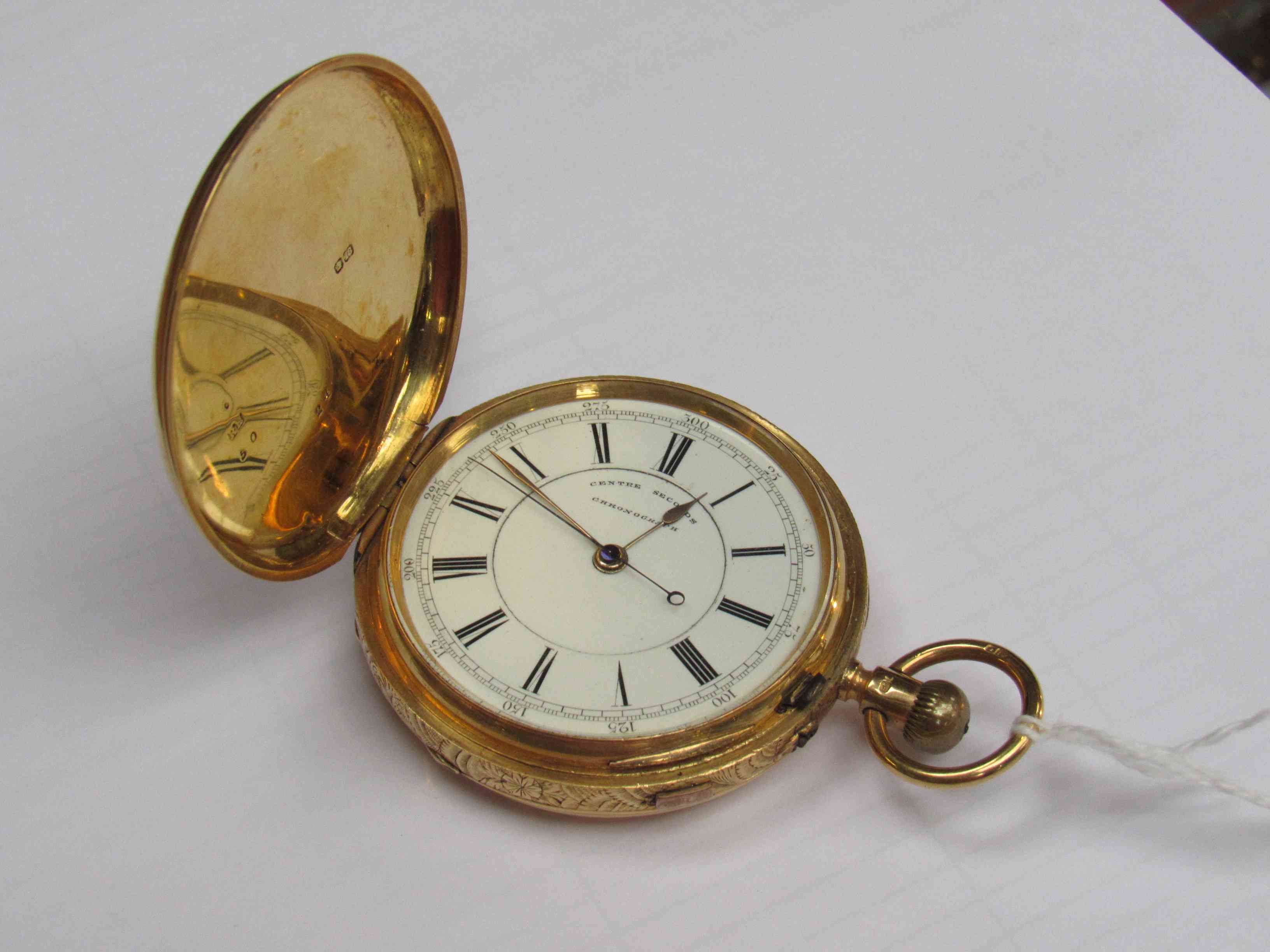 An 18ct gold full hunter centre seconds chronograph pocket watch with Roman enamelled dial