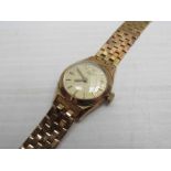 LONGINES: a lady's 9ct gold bracelet watch with spare links,