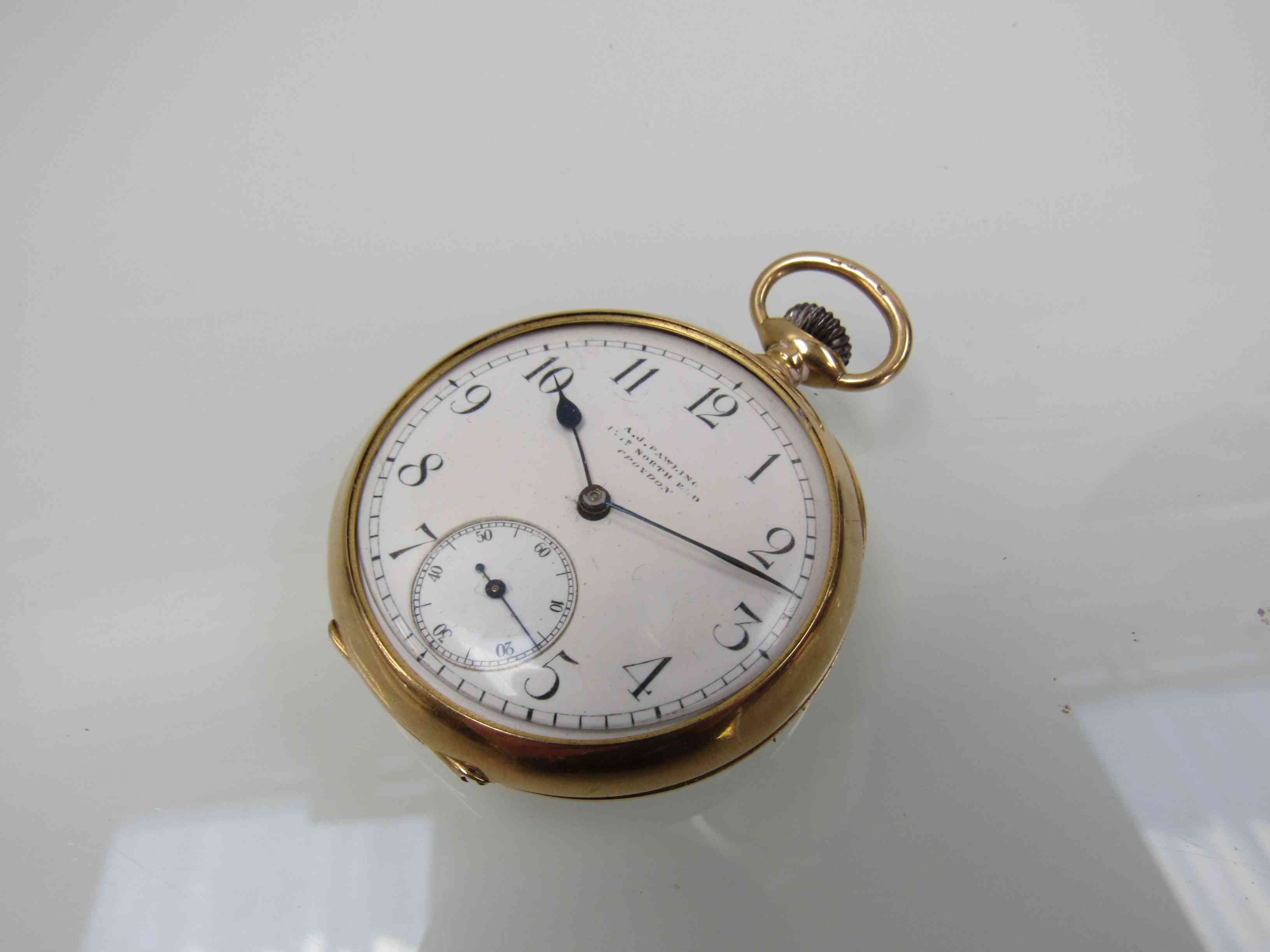 An 18ct gold open faced pocket watch, Arabic enamelled dial with subsidiary seconds signed A.J.
