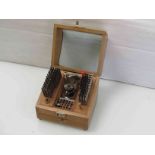 A cased watchmaker's staking set with various stakes,