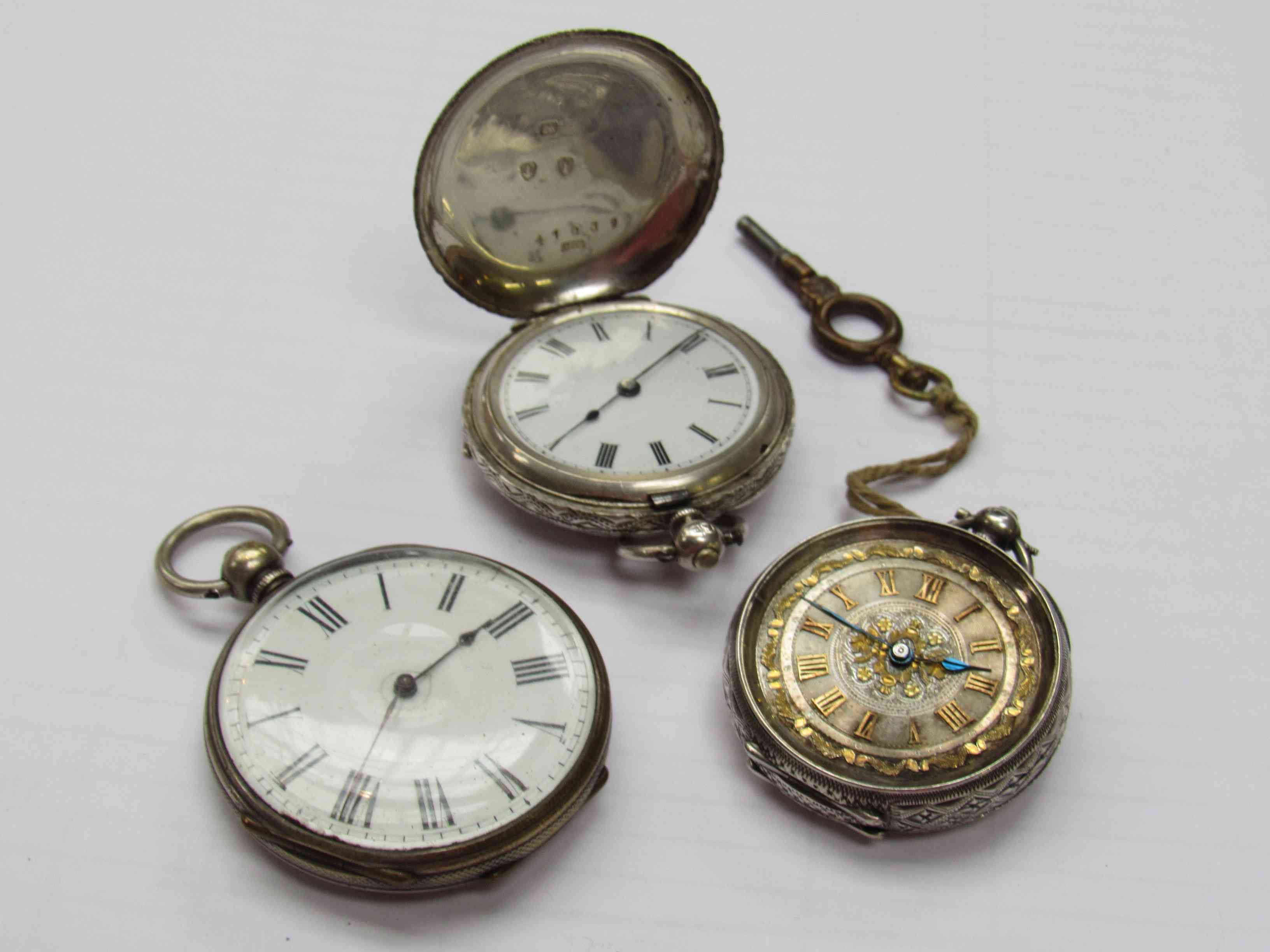 Three silver fob watches