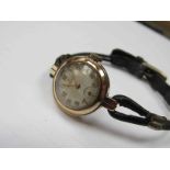 ROLEX: a lady's 9ct gold wristwatch with rope bracelet