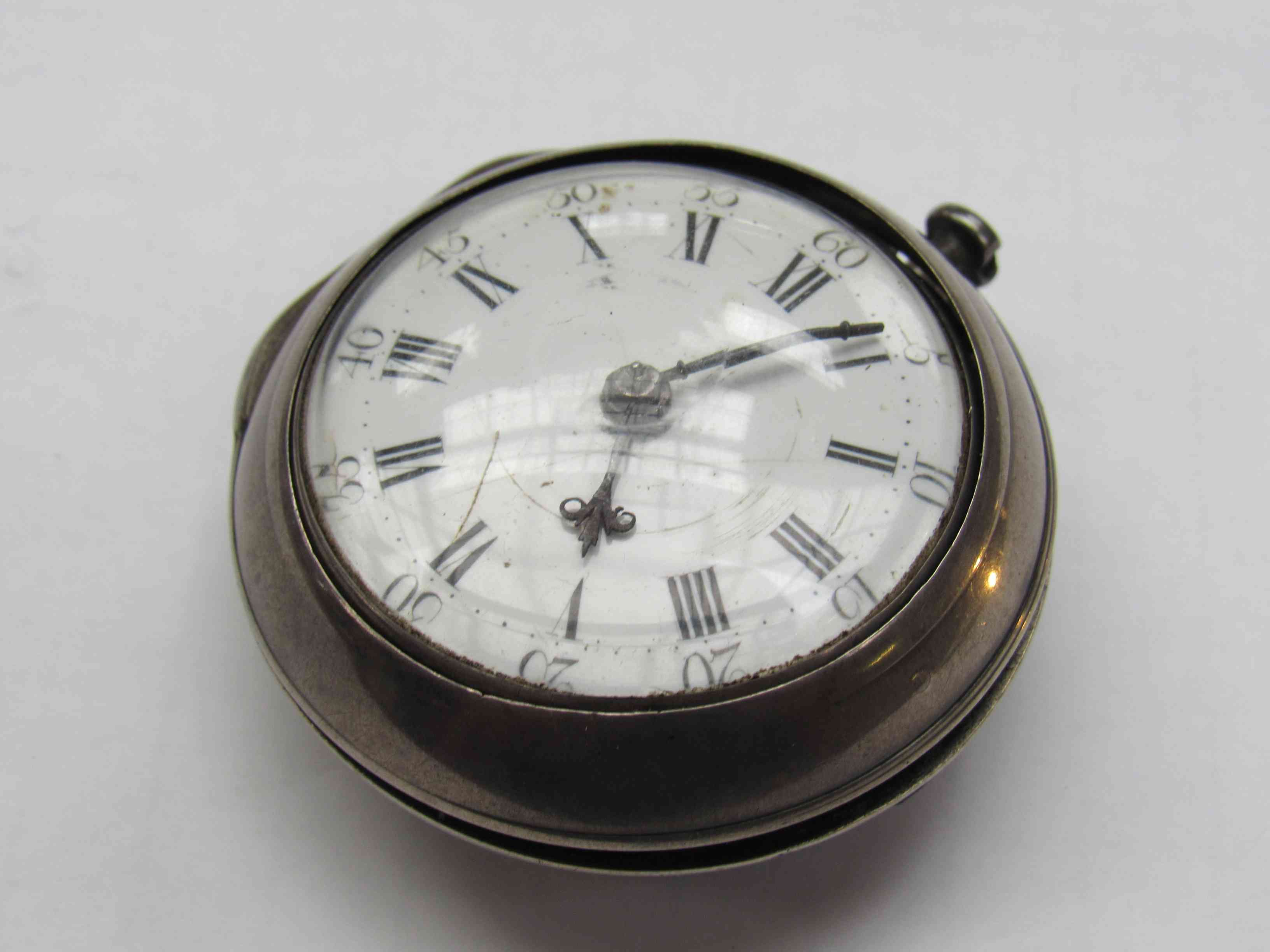 A late 18th Century silver pair case pocket watch with Roman enamelled convex dial,