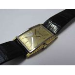 BUECHE GIROD: An 18ct gold cased gent's manual wind wristwatch of curved rectangular form,