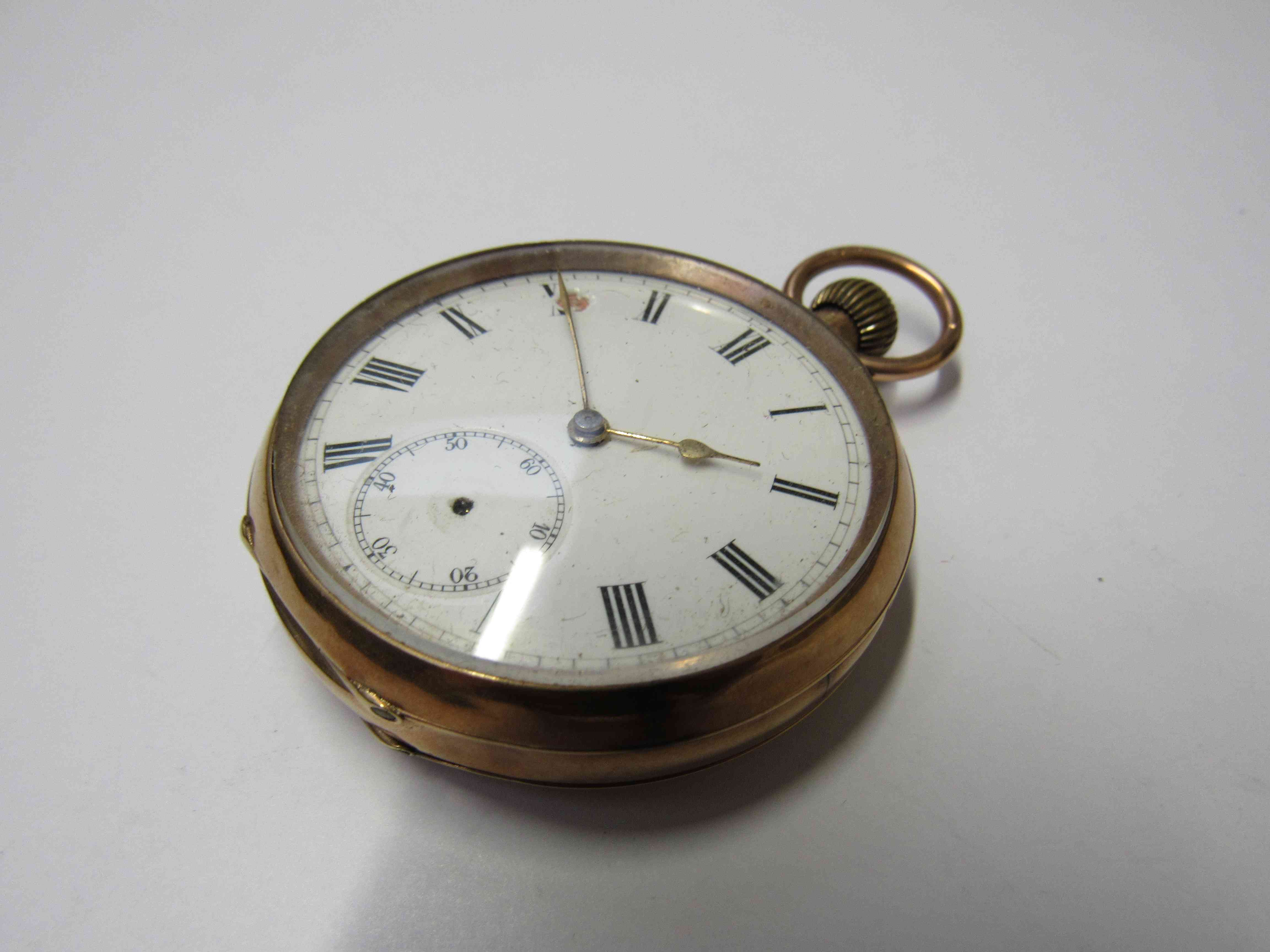 A 9ct gold open faced pocket watch, Roman enamel dial with subsidary seconds,