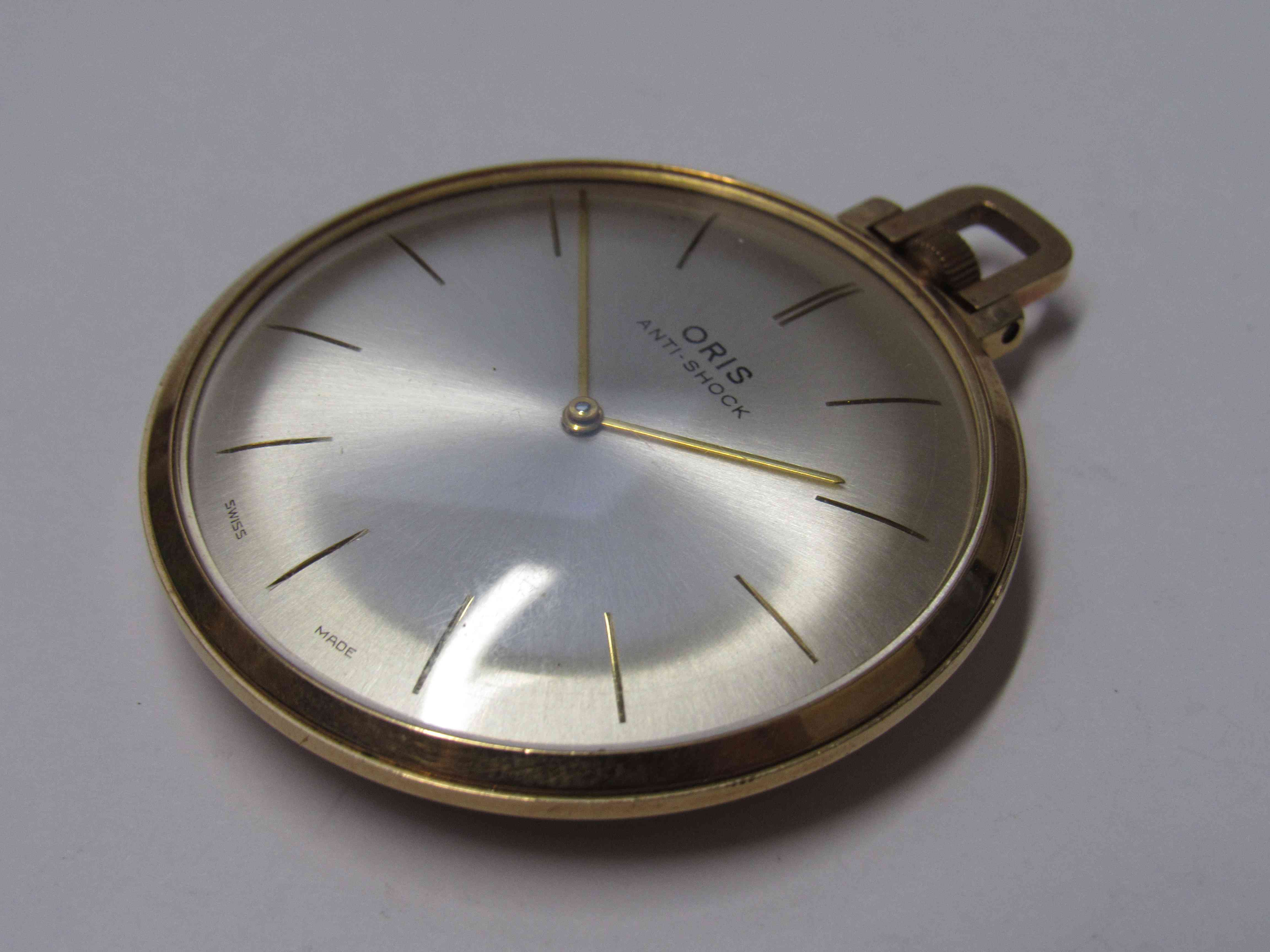 ORIS: An Anti-shock 18ct gold open faced pocket watch of slim proportions,