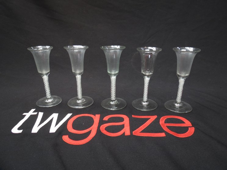 A set of five Georgian double layer cotton-twist stem glasses with bell shaped bowls