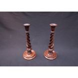 A pair of fine 19th Century mahogany twist stem candlesticks,