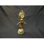 A late 19th/early 20th Century French figural mantel clock with timepiece held aloft by cupid on