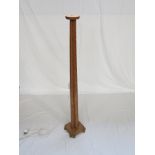 An Art Deco slim oak standard lamp,