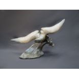 After Henri Lechesne (1869-1878) A bronzed spelter seagull flying over a wave. Signed in the mould.