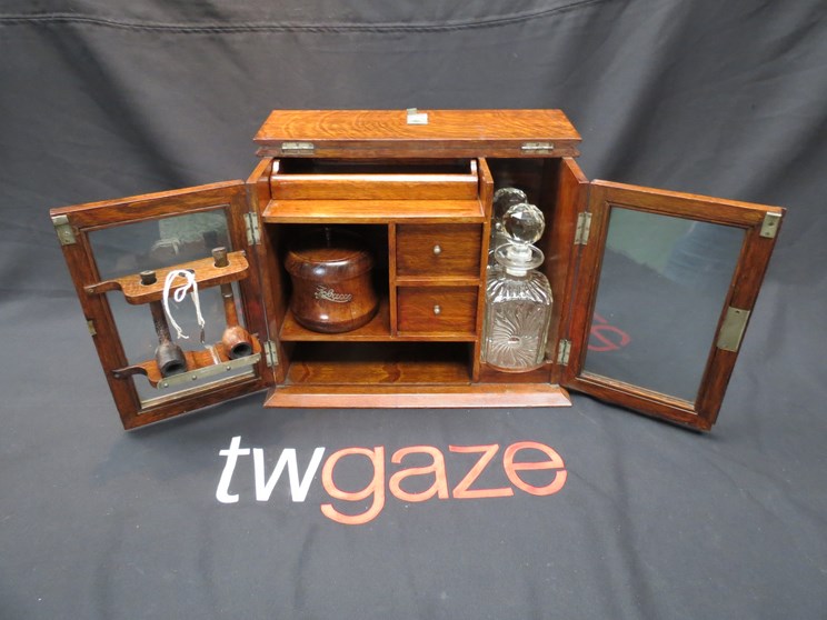A tantalus/smoking cabinet with key, tobacco jar,
