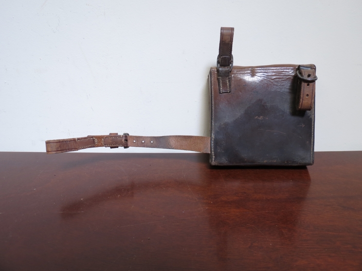 A leather cased sandwich box and flask