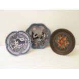 Two Thomas Helstrom of Nittsjo, Sweden, pottery chargers in blue with magpie and horse decoration,