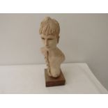 JOAN BANGER (b.1927)A studio sculpture bust of a female nude with plaited hair set on a wooden base,