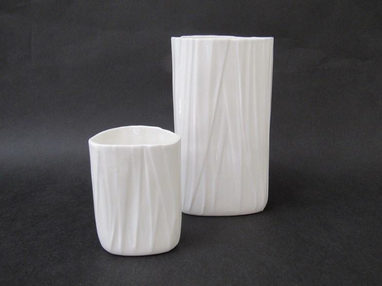 A Royal Doulton "Ambassador" range pair of vases in white gloss glazed, one 19.