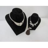 Modernist abstract design necklace with matching earrings and similar necklace,