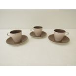 Five Poole Pottery twintone design cups and saucers designed by Robert Jefferson