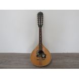 A mid 20th Century teardrop form mandolin with maple bow back,