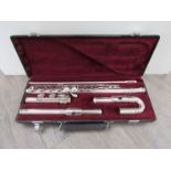 A "Jupiter" silver plated flute, with curved mouthpiece,