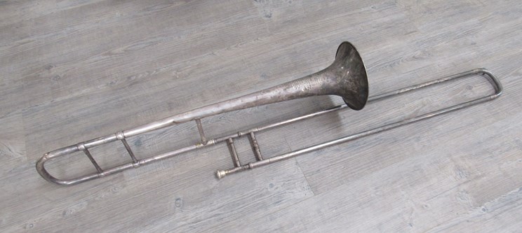 An early 20th Century silver plated trombone,