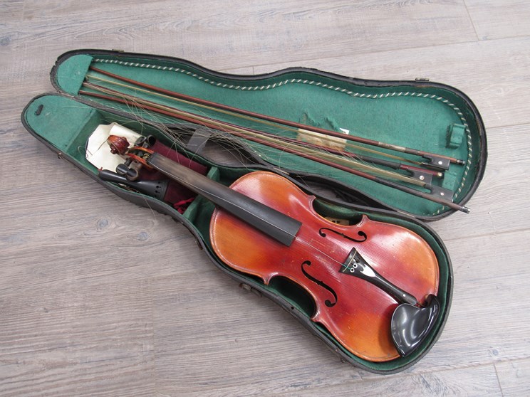 An early to mid 20th Century full size (4/4) violin, 59cm in length, cased with three bows,