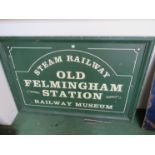 A wooden painted 'OLD FELMINGHAM RAILWAY STATION MUSEUM' sign,