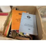 A box containing various hand books,