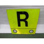 A railway lineside sign showing "R"