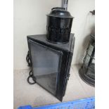 A three sided railway station wall lamp with bracket,