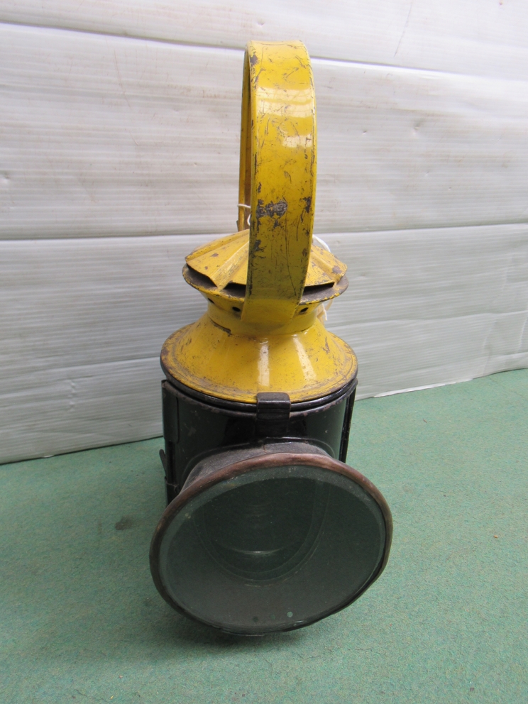 A L.T. (London Transport) four aspect handlamp