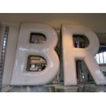 Two B.R enamel lettering signs