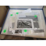 A collection of black and white negatives and prints