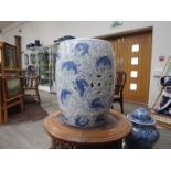 A 20th Century Oriental ceramic barrel form stool with blue and white carp pattern,