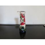 A Moorcroft "Wild Poppy" slender jug. Signed MC vase NE17. Designed by Rachel Bishop.