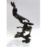 A limited edition solid bronze of two hares boxing, boxed, 89/250,