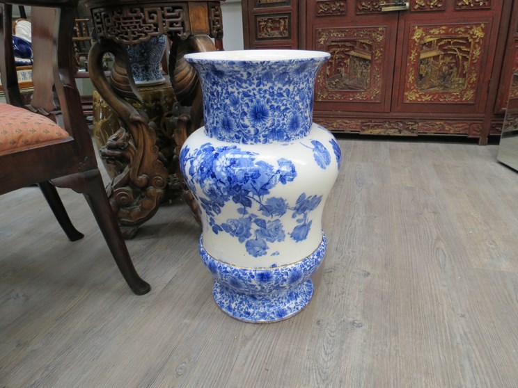 A Doulton blue and white floor vase with floral design,