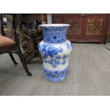 A Doulton blue and white floor vase with floral design,