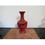 An Oriental carved cinnabar vase,