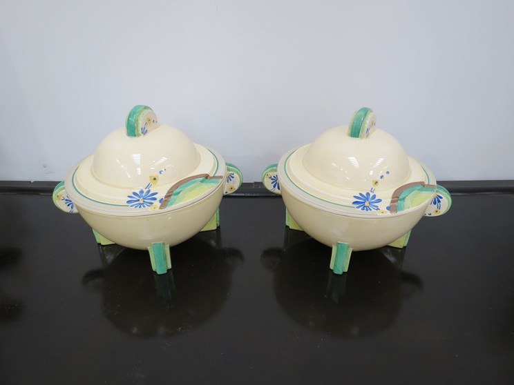 A pair of Clarice Cliff Bizarre pattern tureens with covers