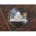 An octagonal marble table top with Taj Mahal design, inlaid with Mother of Pearl,