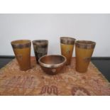 Four Victorian horn beakers with silver rims,