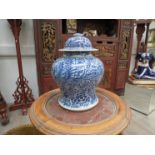 A 19th Century Chinese blue and white porcelain vase of inverted baluster form with domed lid,