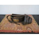 A Victorian leather dog collar and muzzle, the brass tag named H.P.