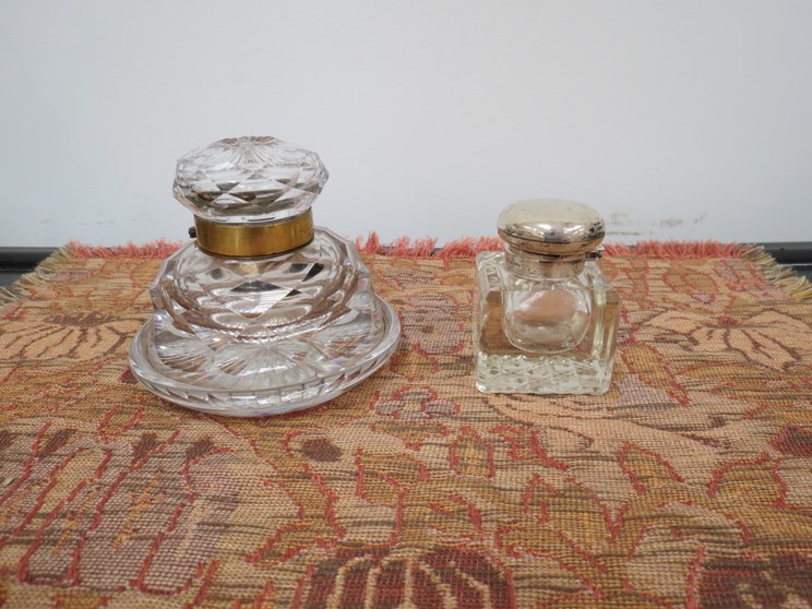 A Victorian cut glass desk inkwell and silver topped inkwell,