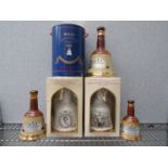 Three graduated Bell's Whisky decanters and three Bell's Whisky decanters "Her Majesty Queen