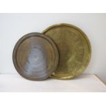 Two early to mid 20th Century brass chargers with Egyptian engraved design,